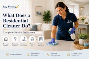 Professional residential cleaner dusting and cleaning a home